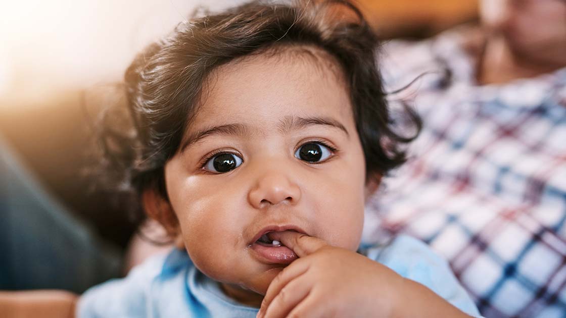 Smiling Baby in Mom's Lap